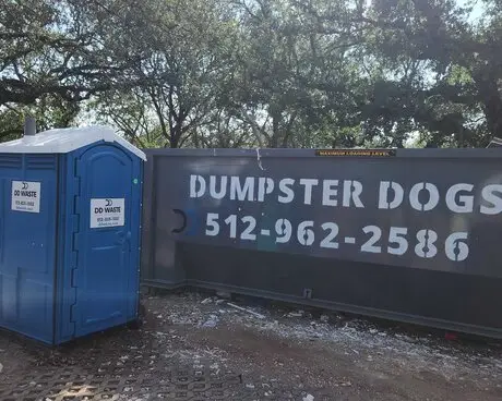Dumpster Dogs portable toilet and roll-off dumpster on site